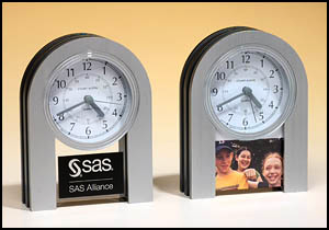 bc928 - Arched brushed aluminum clock with three hand movement, will hold an engraving plate or photo