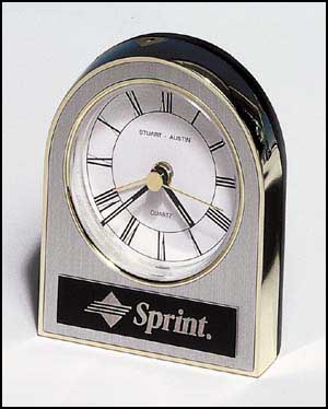 bc93 - Gold, silver and black plastic clock, white dial, alarm movement
